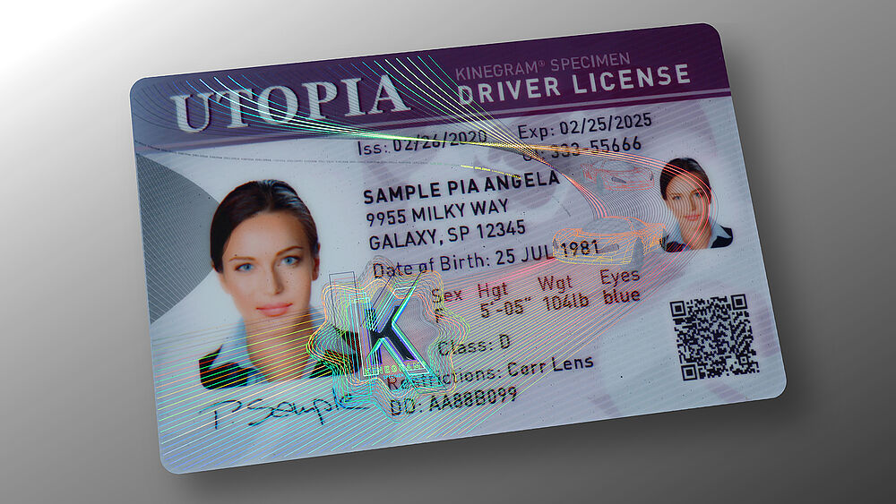 Driver's license sample card showing a Transparent KINEGRAM Overlay (KINEGRAM TKO) combined with KINEGRAM ZERO.ZERO partial metallization Image of a driver's license sample card secured by a Transparent KINEGRAM Overlay (KINEGRAM TKO) combined with KINEGRAM ZERO.ZERO partial metallization
