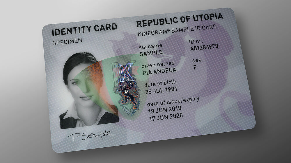 Easy ID verification with an embedded KINEGRAM patch with red-green flip effect (RICS) Image of polycarbonate ID card with embedded KINEGRAM showing a red-green flip effect, this enables easy ID verification