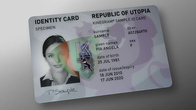 Easy ID verification with an embedded KINEGRAM patch with red-green flip effect (RICS) Image of polycarbonate ID card with embedded KINEGRAM showing a red-green flip effect, this enables easy ID verification