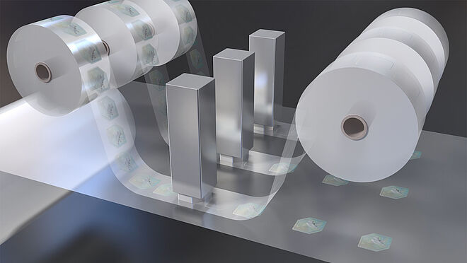 Image of individual DOVIDs being hot-stamped onto a substrate