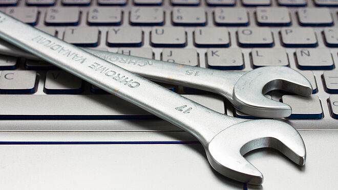 Image of technical tools lying on a keyboard