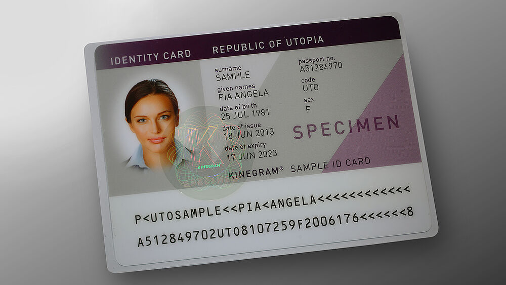 Pouch solution with embedded KINEGRAM to secure personalized paper documents Image of sample pouch-wrapped ID card with embedded KINEGRAM feature to secure the personalized document