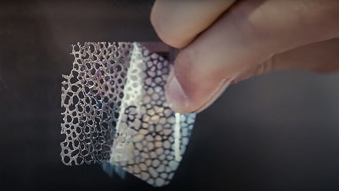 KINEGRAM tamperproof label solution Image of tamperproof KINEGRAM label being pulled off a surface and destroying itself in the process