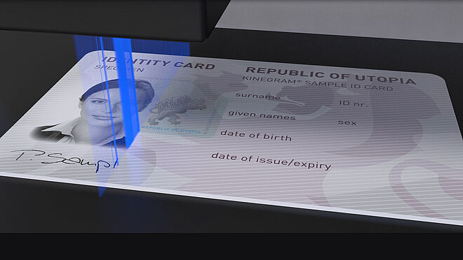 Image of blue laser ray personalizing an ID card