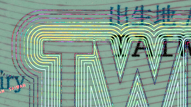 KINEGRAM ZERO.ZERO fineline pump effect on the Taiwan passport. Metallized lines matche the diffractive lines without any tolerance issues. KINEGRAM ZERO.ZERO fineline pump effect on the Taiwan passport. Metallized lines matche the diffractive lines without any tolerance issues.