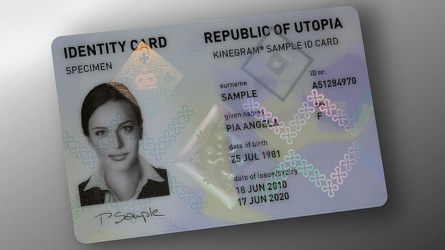 State of the art in ID Protection: embedded KINEGRAM with Full Data Protection (FDP) - "Heraldic" design State of the art in ID protection: image of polycarbonate ID card with embedded KINEGRAM security feature showing a diamond-shaped design