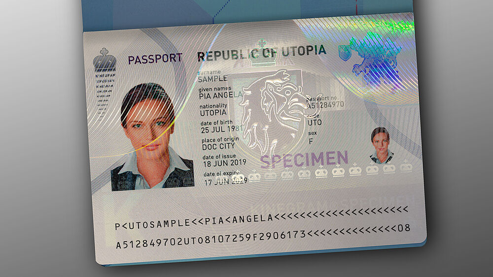 Paper-based passport datapage secured by a Transparent KINEGRAM Overlay (TKO) for passport protection. Image of paper-based sample passport datapage secured by a transparent KINEGRAM overlay in the shape of a lion head.