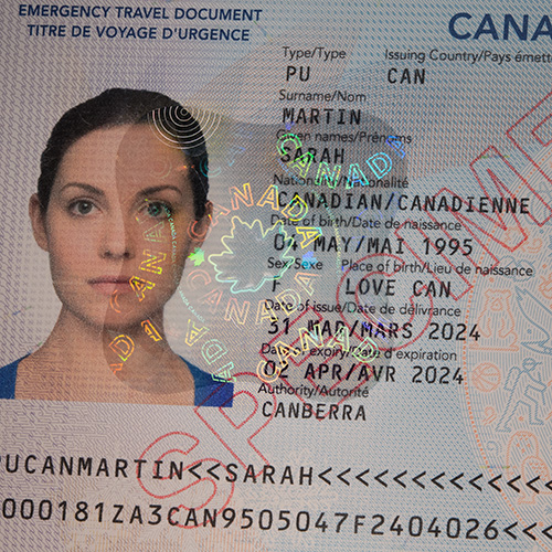 KINEGRAM label security feature on the Canadian Emergency Travel Document. Close-Up of Canadian Emergency Travel Document with KINEGRAM label security feature.